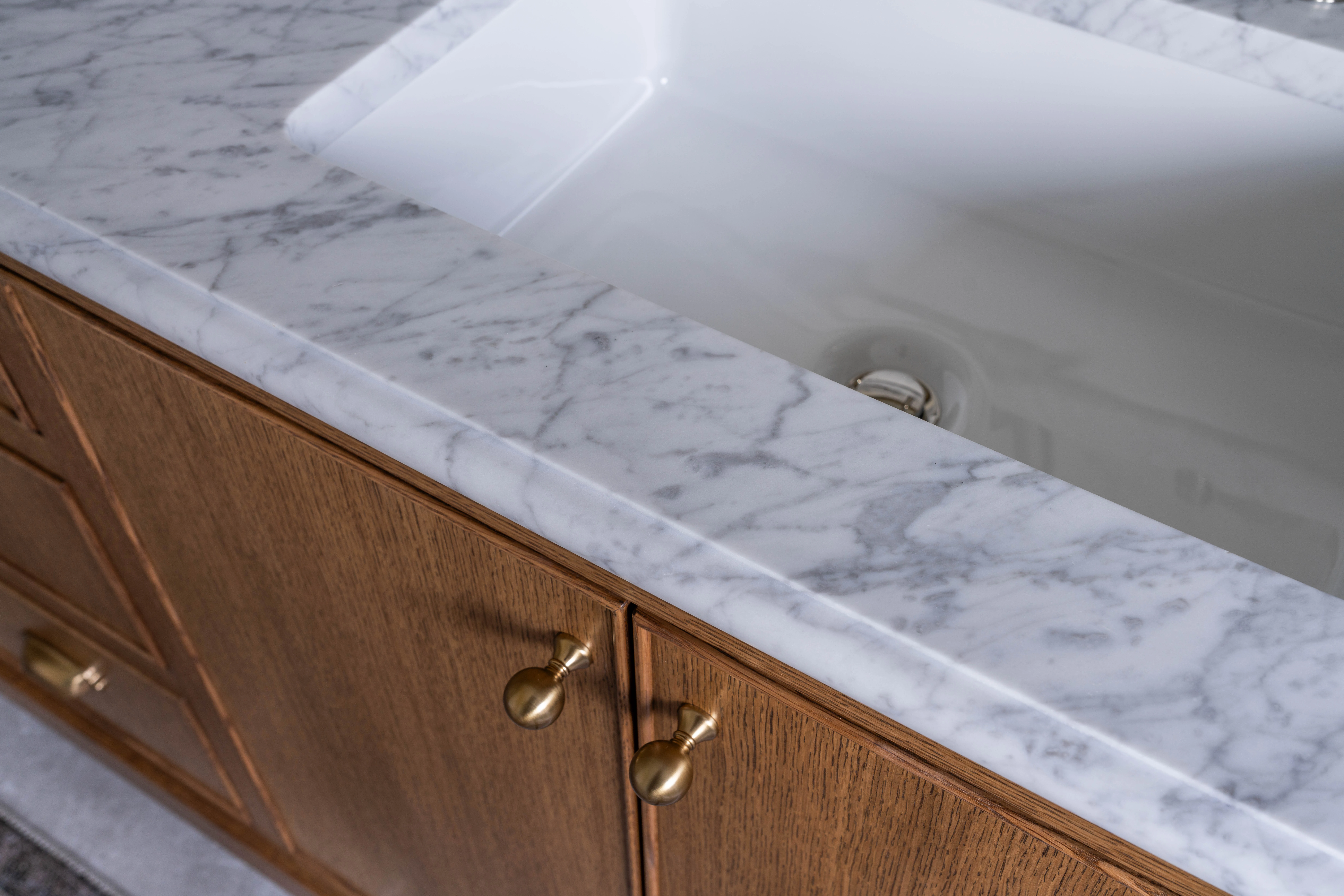 Marble counter and brass fittings on the oak vanity