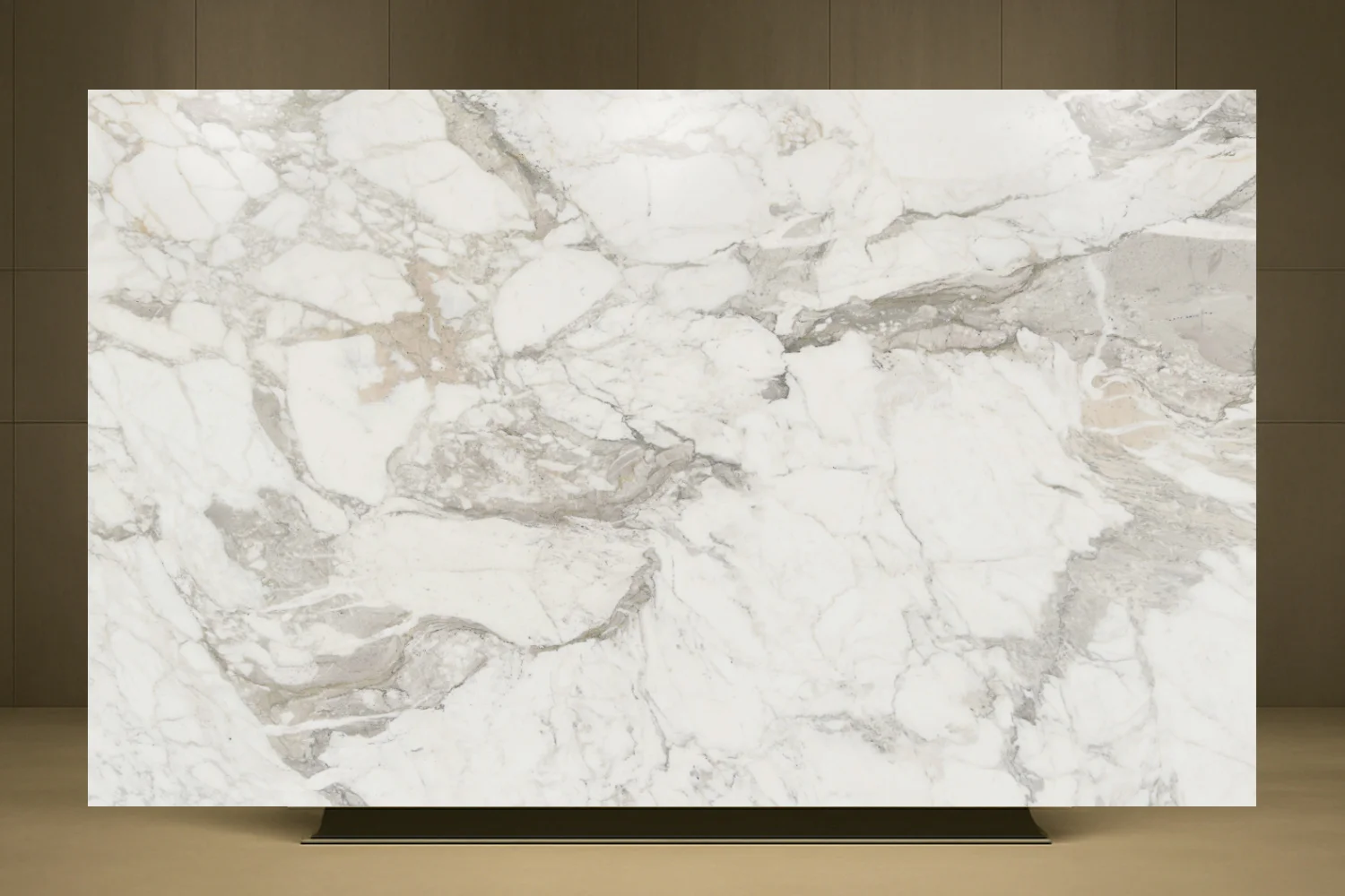 Full Calacatta Vagli marble slab on a display stand, white with grey and soft gold veining