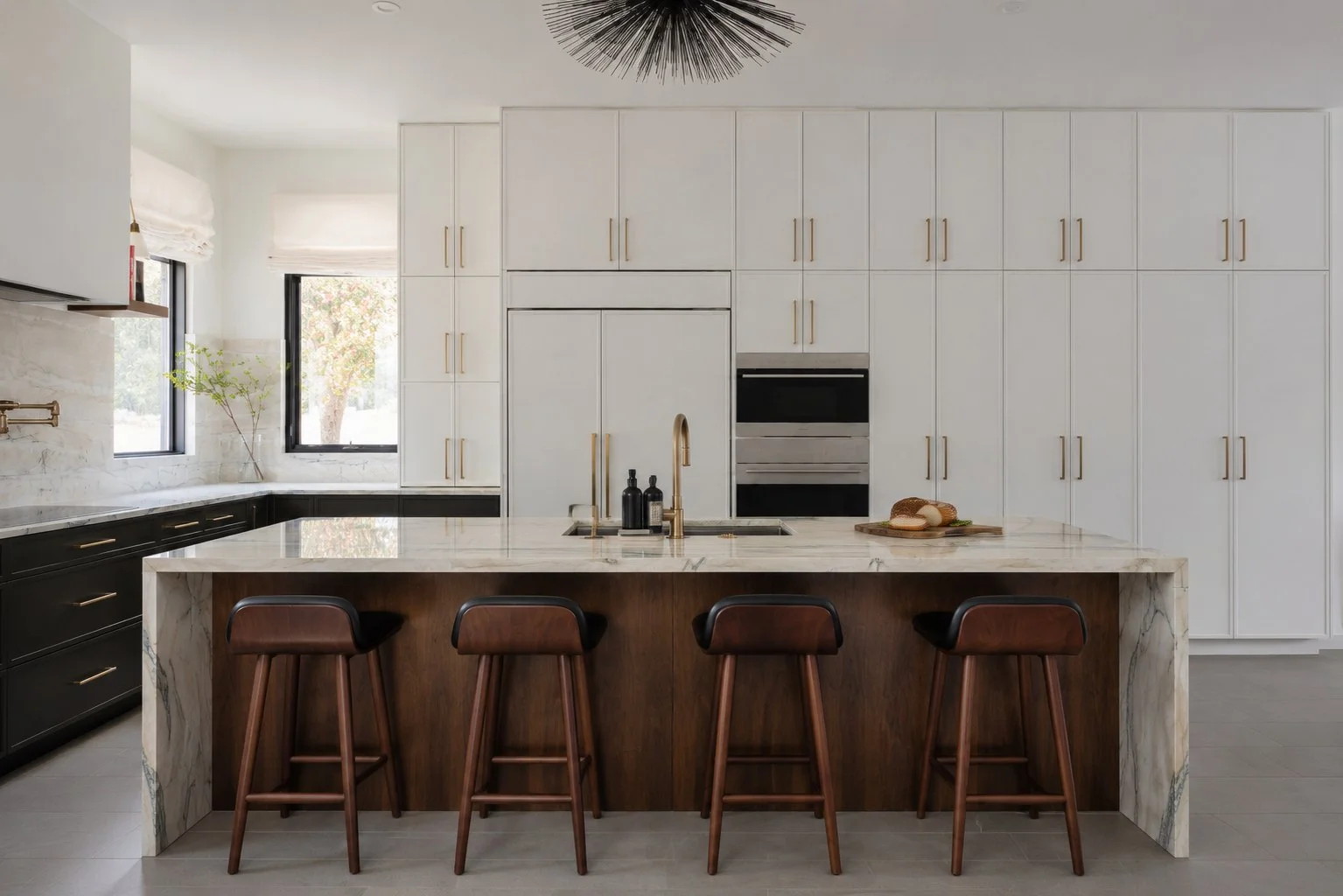 Fantasy Lux quartzite island and backsplash in a white and black Austin kitchen