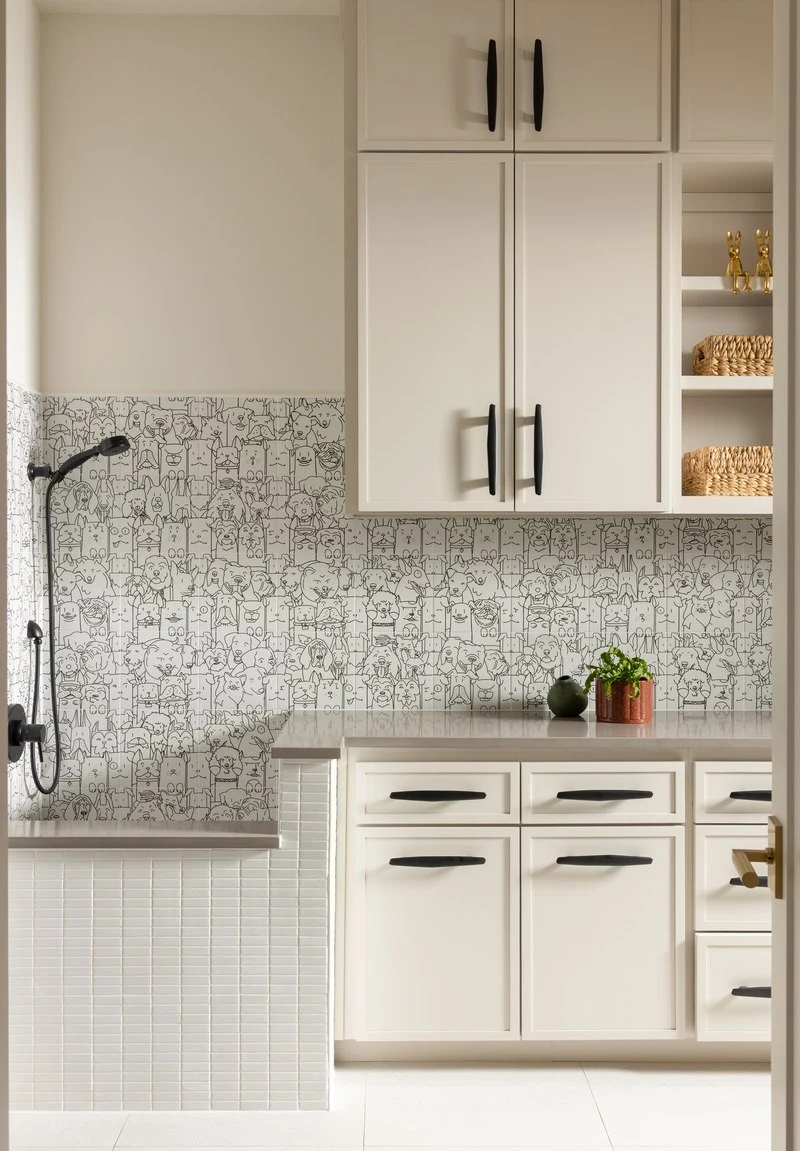 Patterned tile behind the laundry room cabinetry
