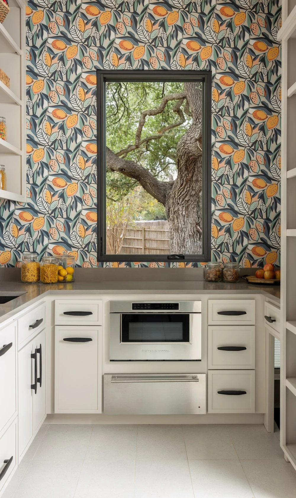 Botanical wallpaper and a live oak view in the walk-in pantry