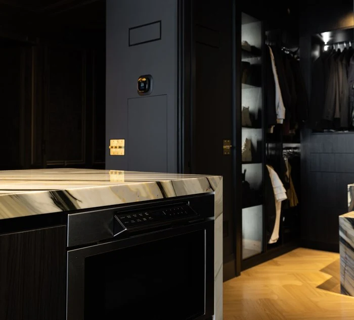 Appliance garage behind blackened cabinet doors