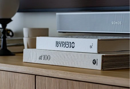 Books and a lamp on the oak credenza