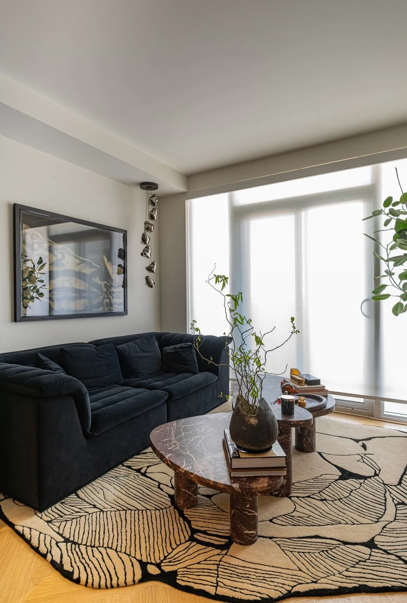 Navy sofa and patterned rug in the living room