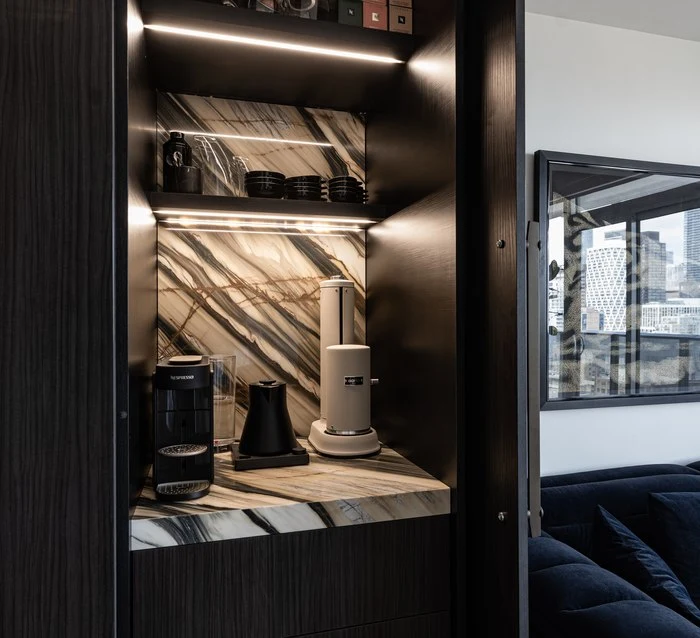 Espresso machine in the blackened pantry cabinet