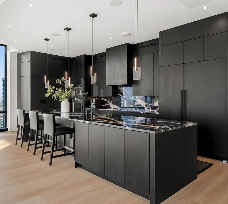 Black pendants over the island and range wall