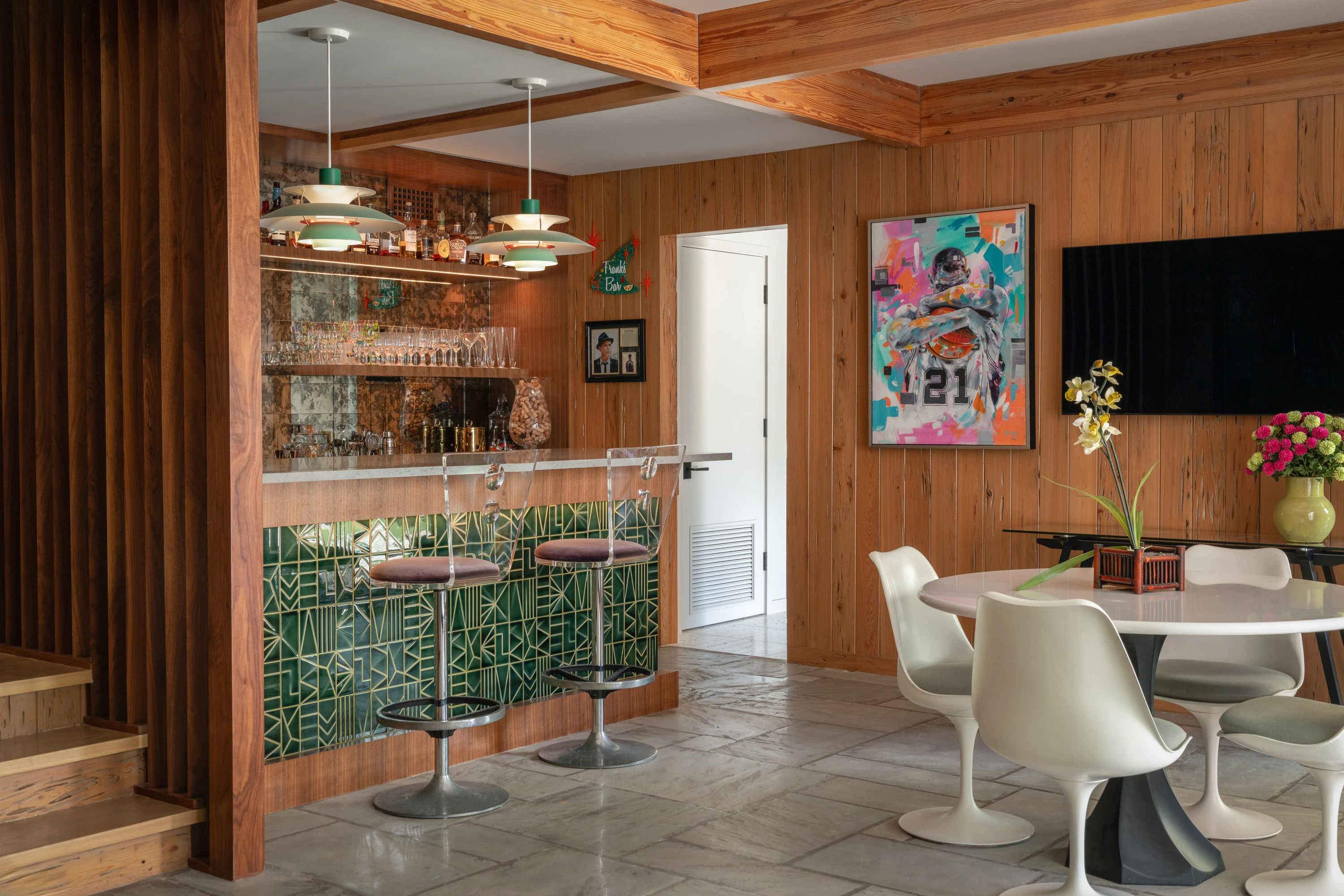 The green-tiled bar open through to the dining area