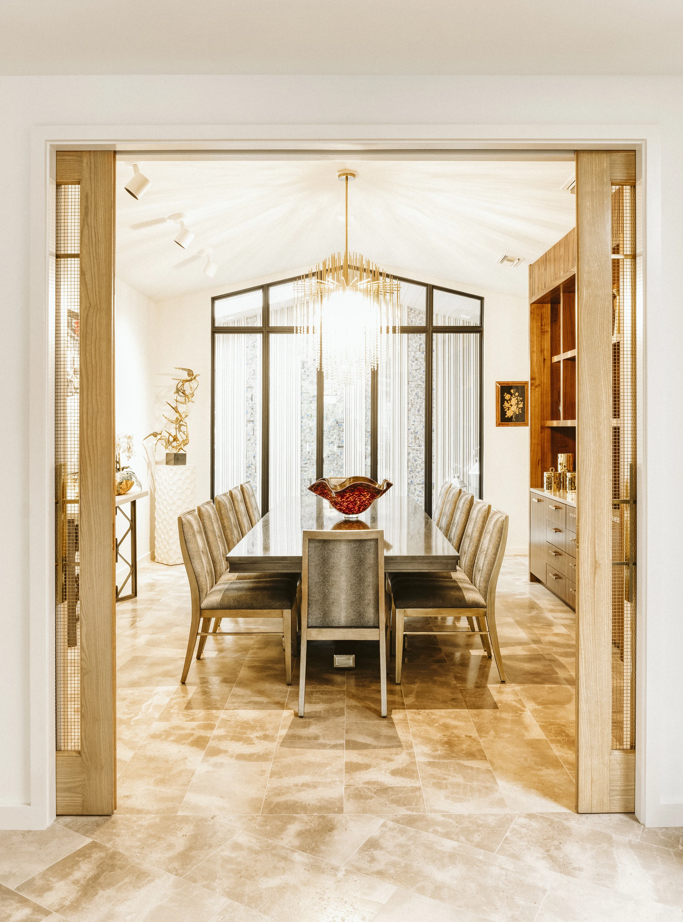 Dining room framed by a timber doorway