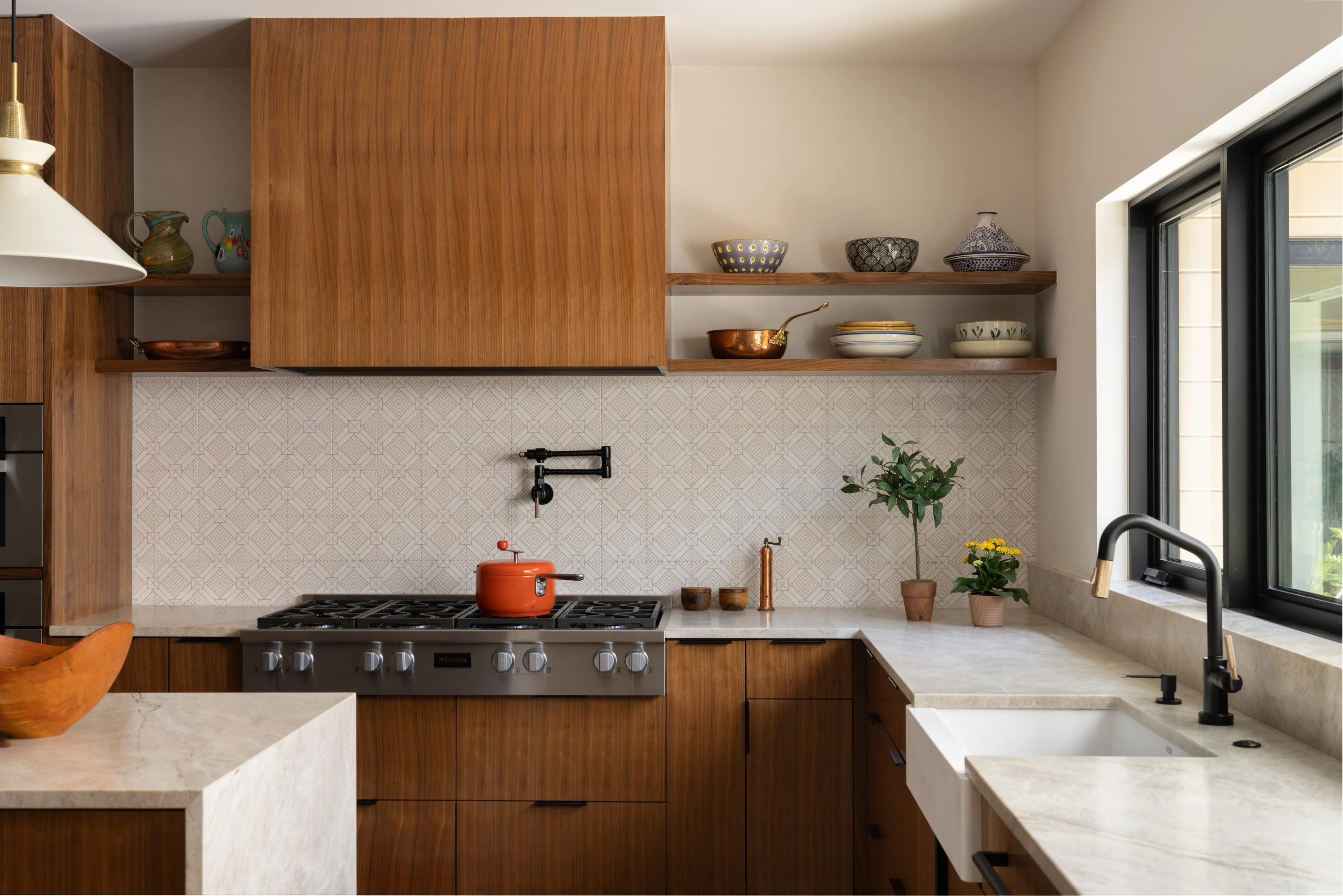 Range and open shelving along the timber kitchen run