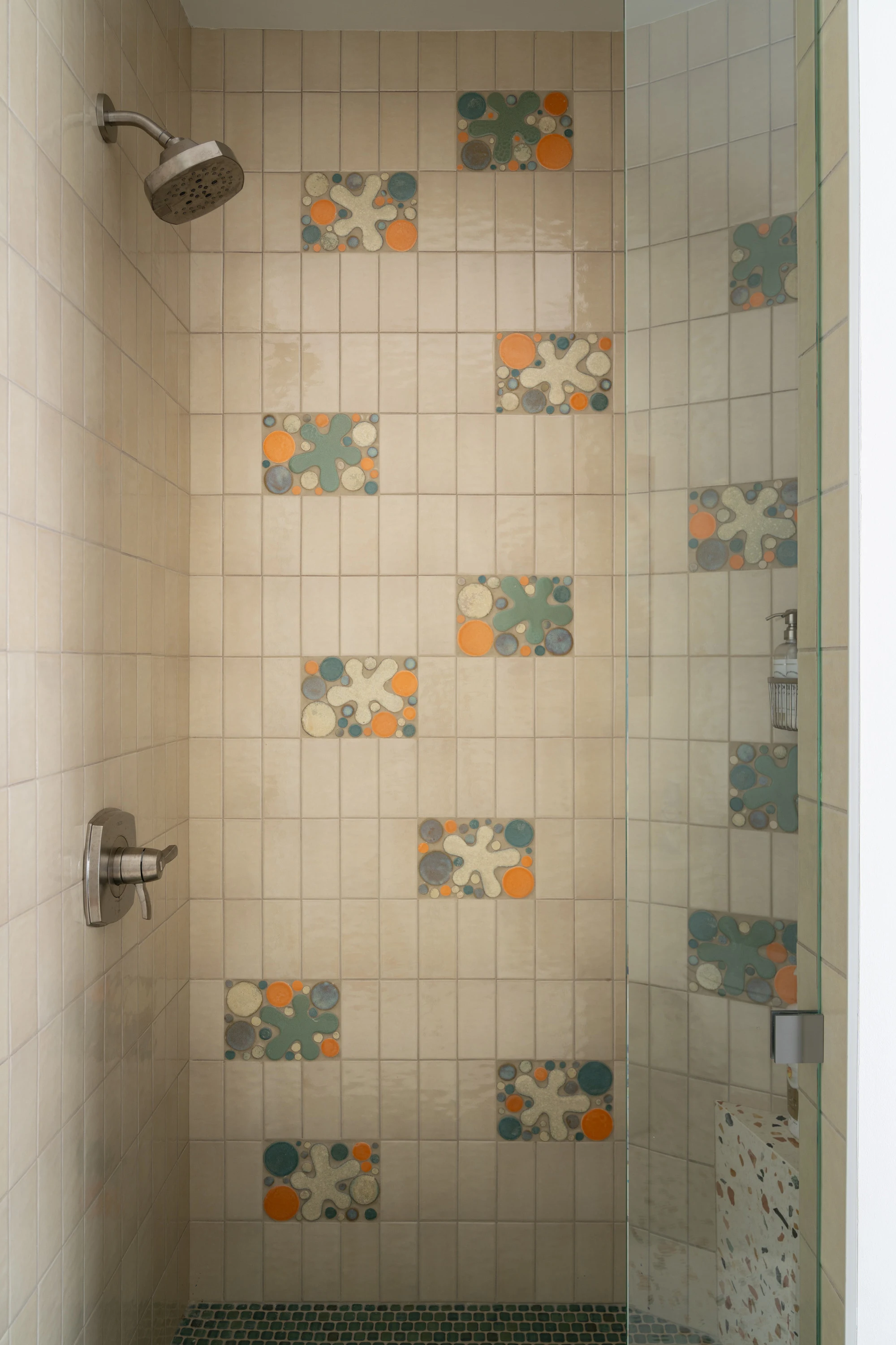 Shower lined in patterned ceramic tile